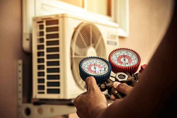 Professional Air Conditioning Service technician working in Squires, MO